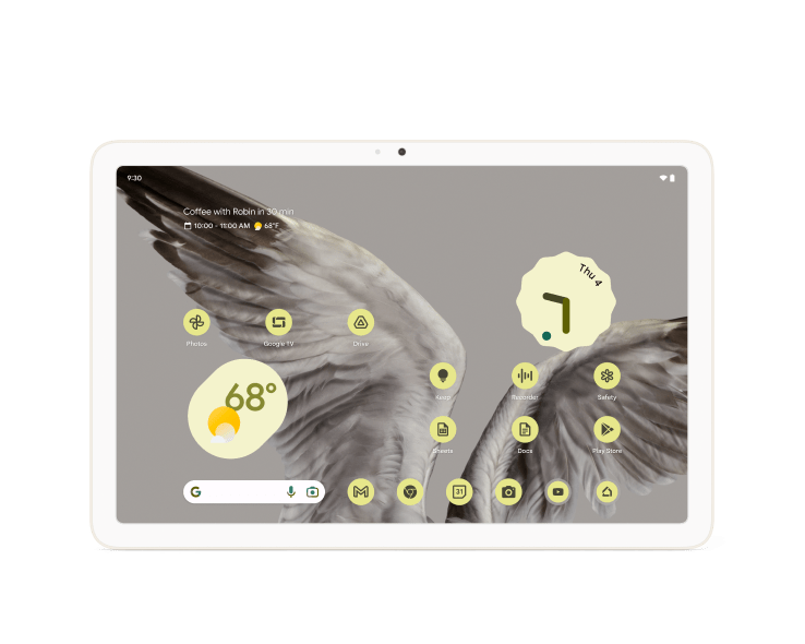 A Pixel Tablet displaying home screen icons and widgets with a wallpaper background of wings in flight.